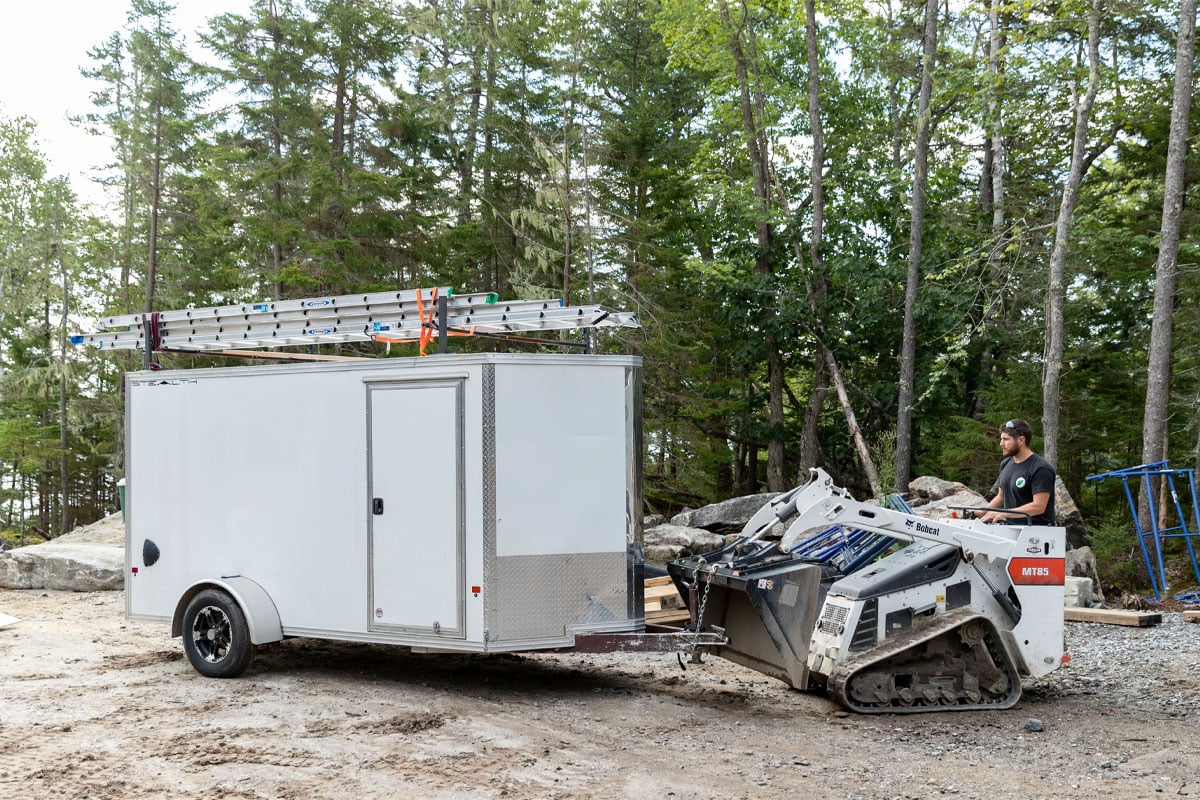 enclosed-5-6-wide-cargo-trailer-parked-at-contruction-site